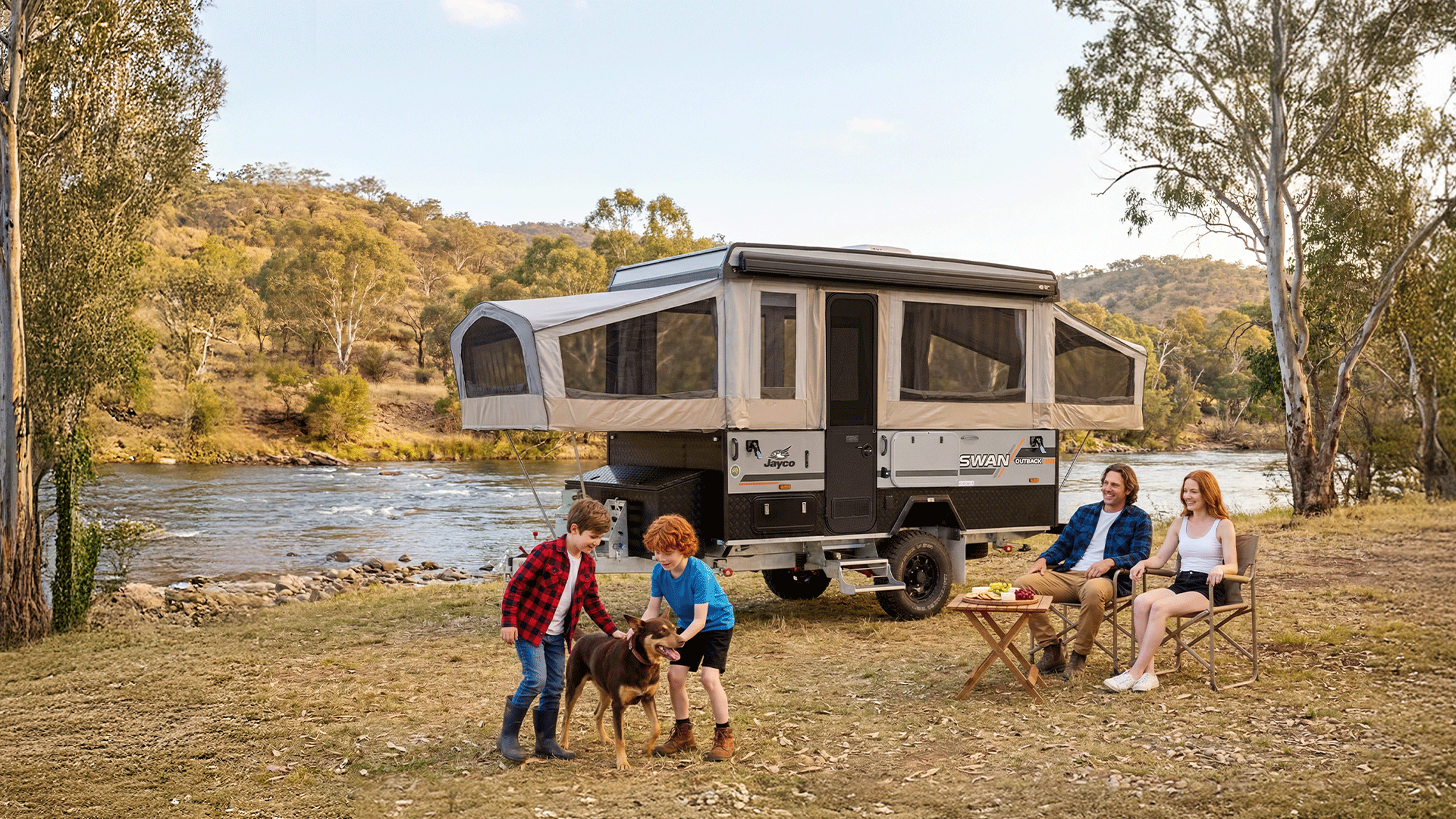 Caravan and trailer setup in an outdoor setting